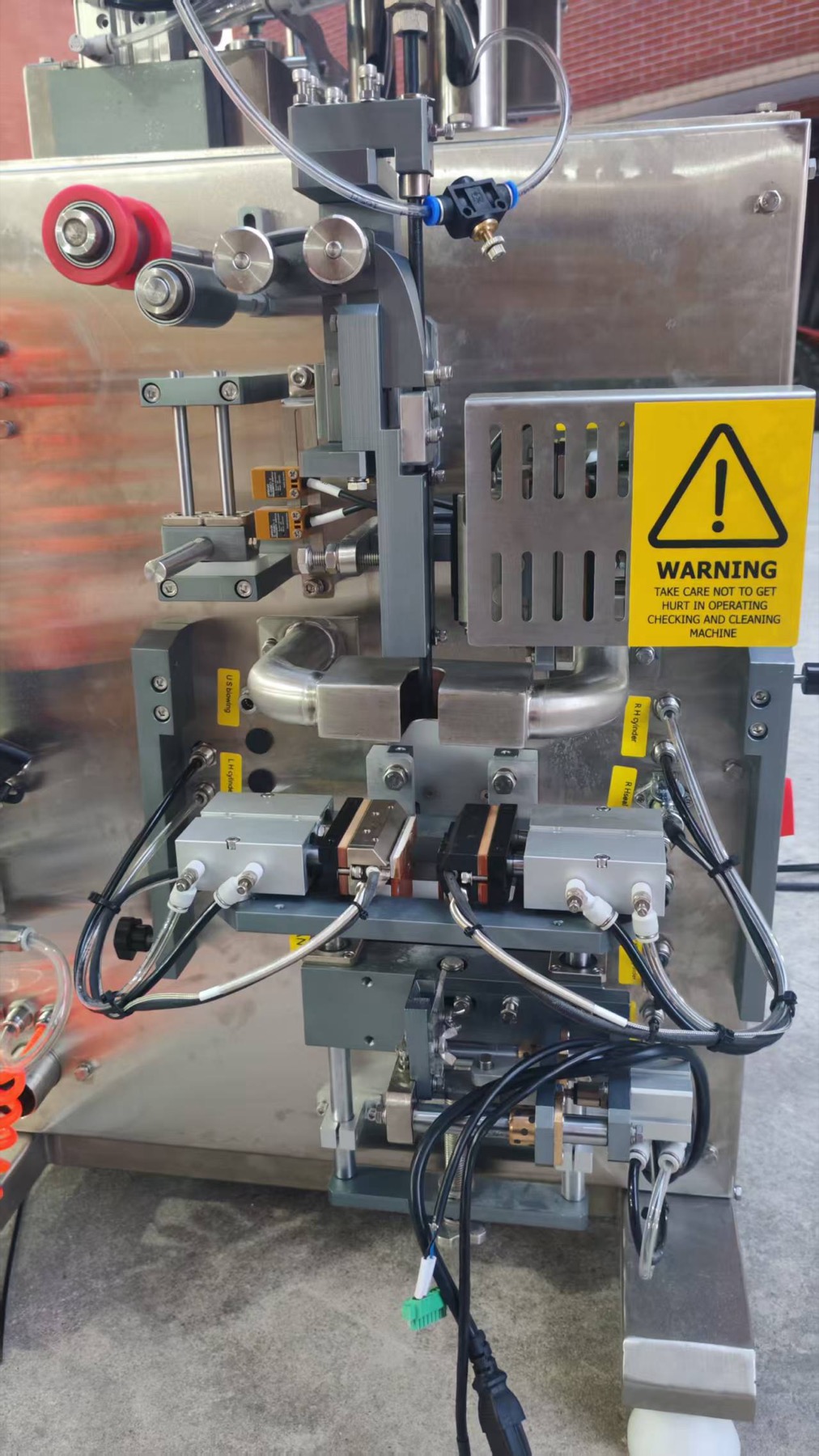 Close view of the film path and pouch forming section on the experimental machine
