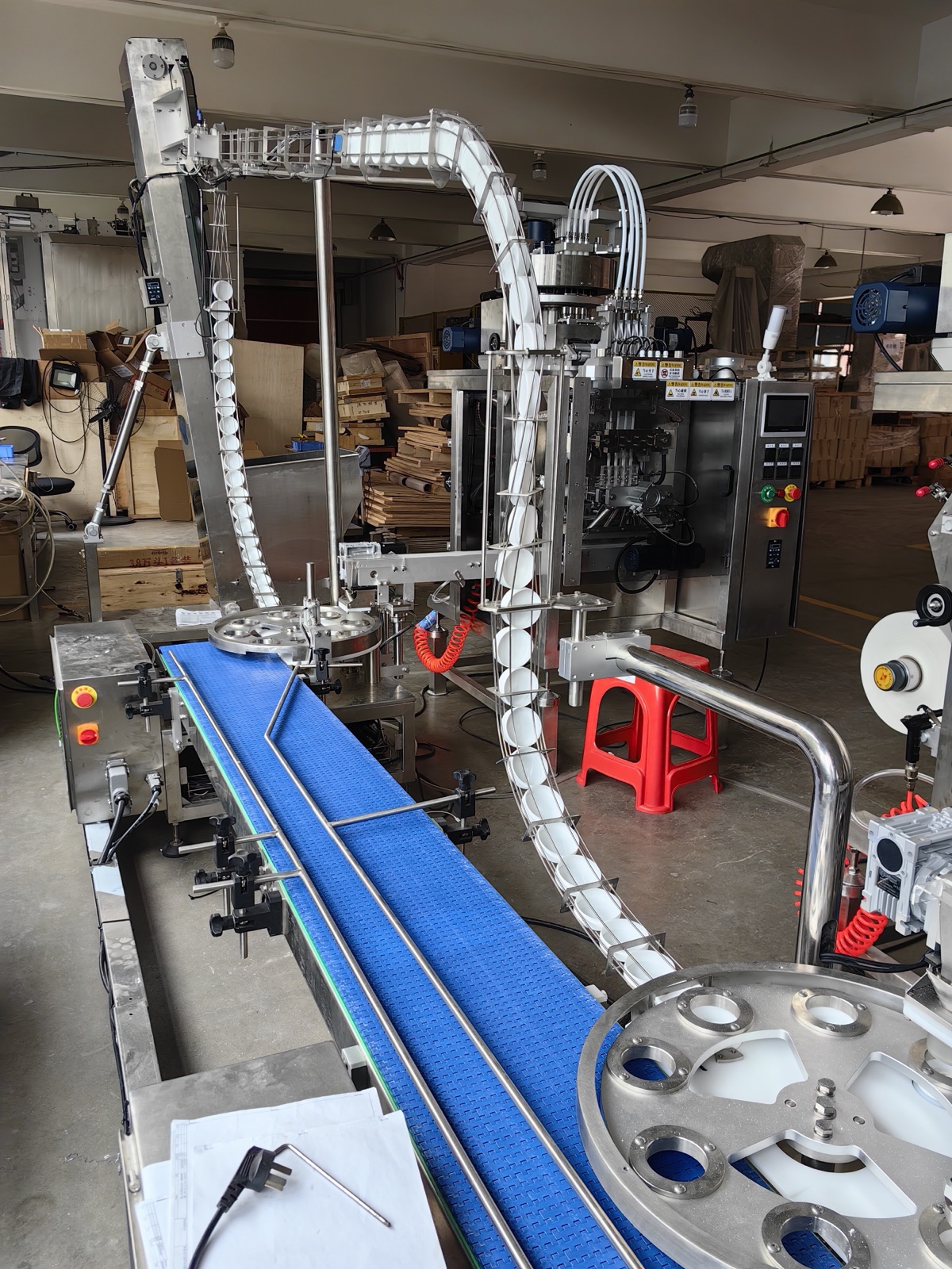 Pouch transfer conveyors and downstream handling modules